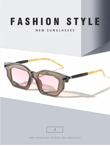 Detail of geometric two-tone sunglasses with pink lenses and taupe transparent frames