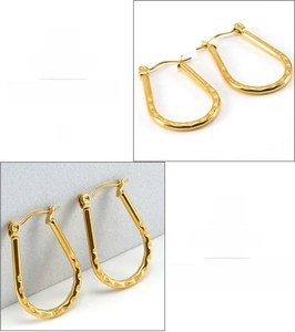 Macro shot of 18K gold plated stainless steel U-shaped earrings with hammered texture