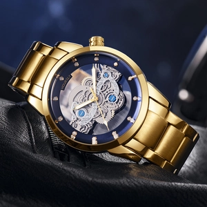 Macro view of a gold-plated skeleton dial watch with intricate mechanical movement gears