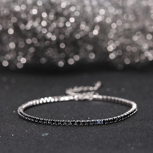 Detailed macro view of 925 sterling silver tennis bracelet with black zircon stones