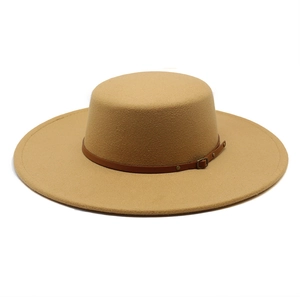Detail of camel wool felt boater hat featuring a brown leather band with metal buckle