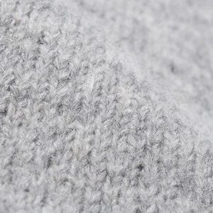 Thick grey knit slouchy beanie made of soft mohair wool for winter warmth and style
