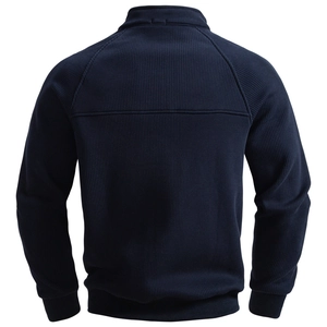 Macro shot of dark blue knit fabric texture and ribbed hem on men's zip sweatshirt