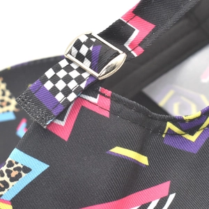 Detail of adjustable silver buckle on black canvas graffiti cap with leopard print