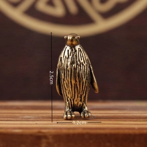 Miniature brass penguin figurine with vintage texture, size 2.5cm by 1.2cm desk decor