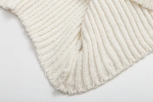 Close-up of premium white ribbed knit fabric texture showing high-quality textile detail