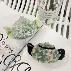 Minimalist acetate hair claws in teapot shape with marble floral patterns set of two
