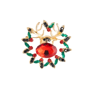 Christmas reindeer brooch with gold antlers, red crystal nose and festive holly wreath