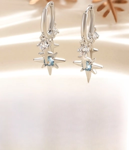Silver star drop earrings with blue zircon inlays and detailed 10mm inner diameter measure