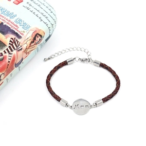 Detailed shot of braided leather bracelet with Mom heart charm and stainless steel clasp
