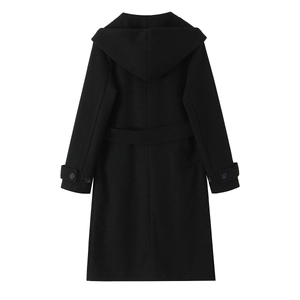 Detail view of the hooded black wool coat back with waist belt and decorative cuffs