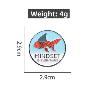 Detailed view of enamel goldfish pin with Mindset Is Everything text, size 2.9cm and 4g