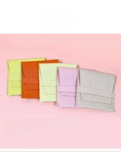 Five microfiber envelope jewelry pouches in lime, orange, mint, lavender, and grey