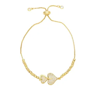 Adjustable 18K gold heart cross bracelet with pavé cubic zirconia on box chain