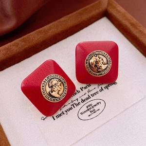 Vintage rhombus faux leather earrings with gold embossed portrait on red litchi texture