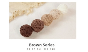 Close-up of 5cm knitted yarn balls in gradient brown tones for Christmas tree decor