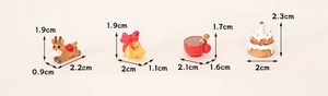 Miniature resin Christmas charms set featuring reindeer and bell for DIY festive decor