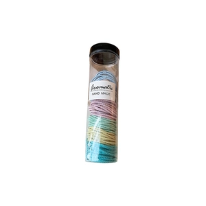 Colorful elastic hair ties set with artificial crystals in a transparent tube container