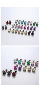 Detailed close-up of multi-colored zircon screw earrings with secure claw setting