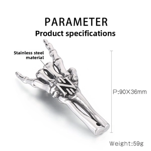 Macro detail of rock gothic skeleton hand pendant in vintage stainless steel finish