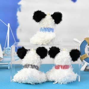 Back view of three cute West Highland White Terrier plush dog keychains with scarves