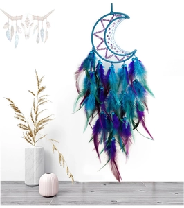 Detail of blue moon-shaped dream catcher with gradient feathers and beads decor