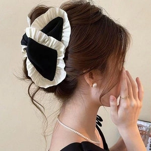 Elegant black and white ruffled bow hair claw clip with pearls for sophisticated styling