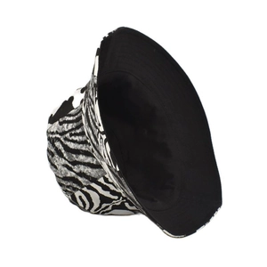 Detail of a zebra print cotton bucket hat showing the black and white animal pattern texture