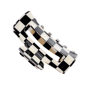 Classic black and white checkered shark hair claw clip for women with a glossy finish
