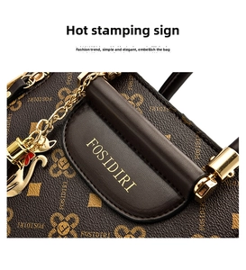 Close-up of FOSIDIRI embossed leather texture with golden brand logo and metallic hardware
