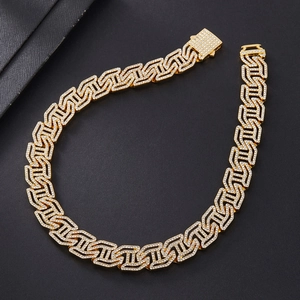 Detailed close-up of 16mm gold Cuban link necklace with sparkling full diamond inlay
