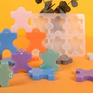 Macro detail of 6-hole silicone mold with colorful interlocking puzzle figure figures