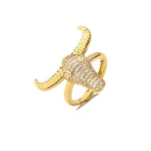 Detailed close-up of a gold bull head ring with micro-pave cubic zirconia settings