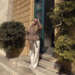 Chic brown long-sleeve waist-tie blazer jacket for women paired with white wide-leg pants