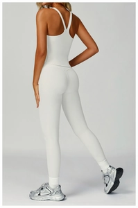 Detail view of white ribbed yoga set featuring racerback top and high waist leggings