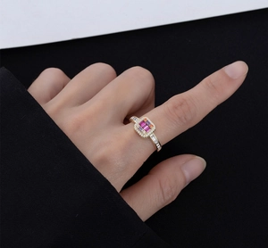 Detailed view of S925 silver 14k gold ring with square pink and orange micro diamonds