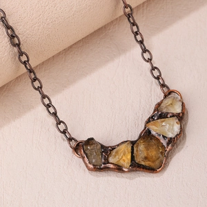 Vintage bronze necklace featuring irregular natural amethyst and citrine stone pendants