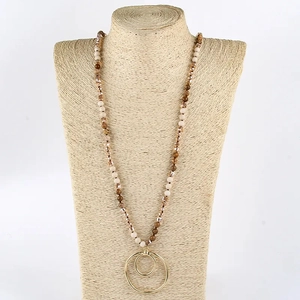 Beaded long necklace with semi-precious stones and golden double-ring pendant display