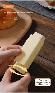 Close-up of rotatable yellow butter spreader stick applying butter on fresh bread