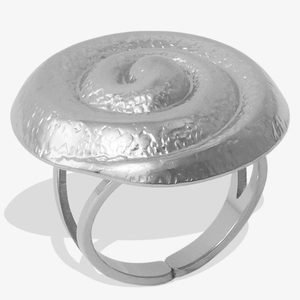 Macro detail of silver vortex spiral ring showing its metallic texture and double band