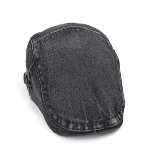 Detailed close-up of dark grey washed denim beret with vintage stitching on white background