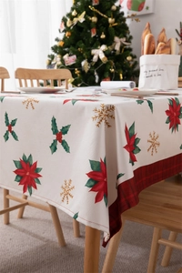 Detailed view of waterproof polyester Christmas tablecloth with poinsettia and plaid edge