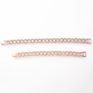 Close-up of rose gold Cuban link necklace set with sparkling pave-set rhinestones