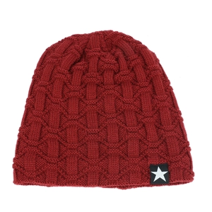 Close-up of deep red basket weave knit beanie with a white five-pointed star cloth label