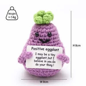 Macro shot of 8cm crochet eggplant plush with 14g weight and positive encouragement card