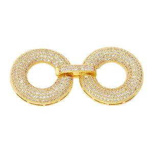 Detailed view of a gold-plated connector clasp with micro-paved sparkling cubic zirconia