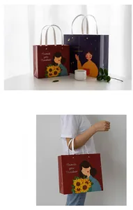 Detail der Thank You Teacher Geschenktüten in Rot und Blau mit weißen Seilgriffen