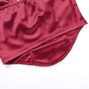 Close-up of wine red satin camisole showing smooth fabric texture and neat stitching