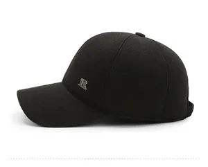 Detailed side view of black winter baseball cap showing wool fabric and metal R logo