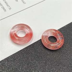 Macro shot of 20mm coral pink agate abacus beads with large 8mm holes for DIY jewelry
